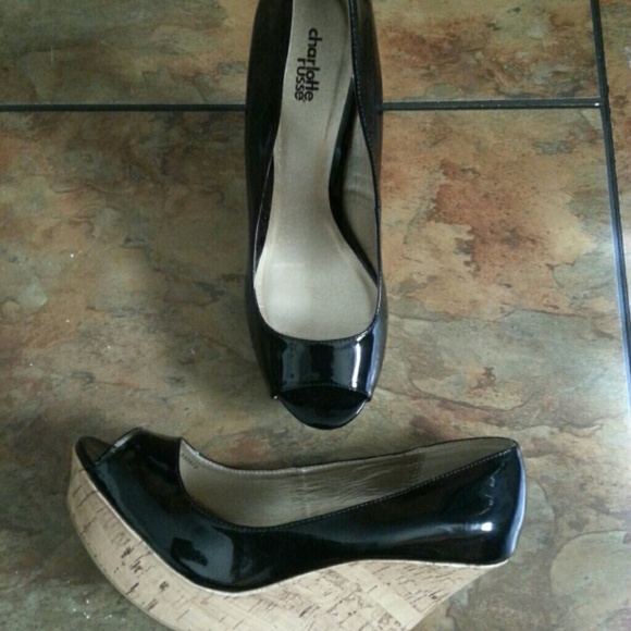 Open toe, cork screw, shiny black, wedged heels.