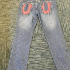 True Relijion jeans with red logo on back pocket