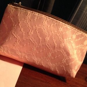 Mary Kay handheld purse. Light pink in color.