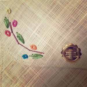 Pretty flower embroidery rattan clutch