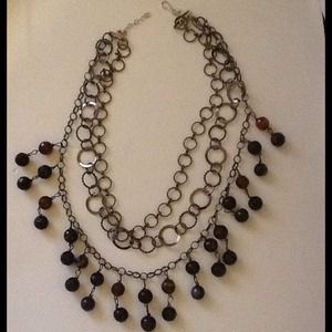 Dazzle tonight with triple chain necklace.