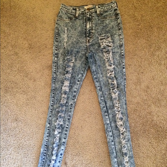 High waisted, acid wash, distressed denim jeans.