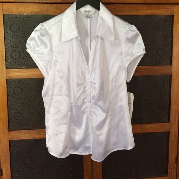 White cap sleeve, shirted front blouse. 100% poly