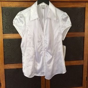 White cap sleeve, shirted front blouse. 100% poly