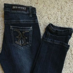Red Rivet studded dark wash skinny jeans,
