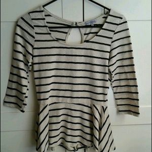 Cream and black peplum top