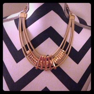Gold/nude necklace.