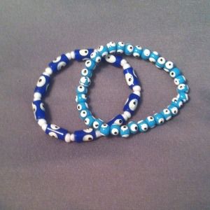 Bundle of blue evil eye bracelets.