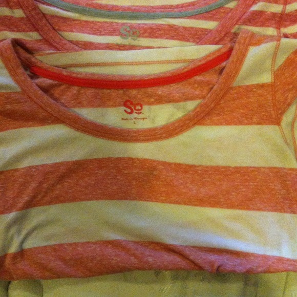 So! shirts available orange and a pink and yellow