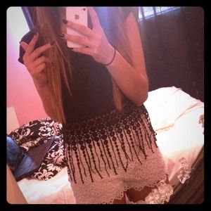 A black shirt with tassels