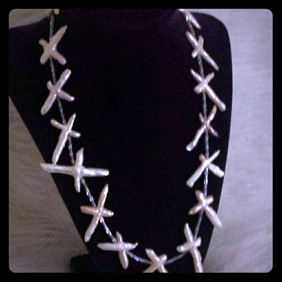 Fresh water pearl cross necklace.
