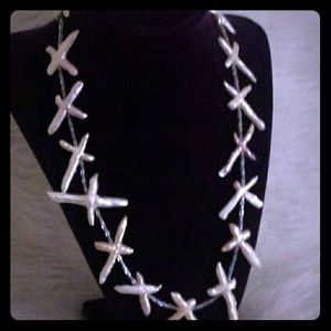 Fresh water pearl cross necklace.