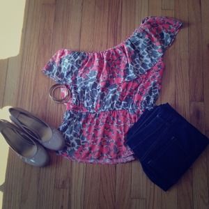 One shoulder, pink, grey, and tan patterned top.