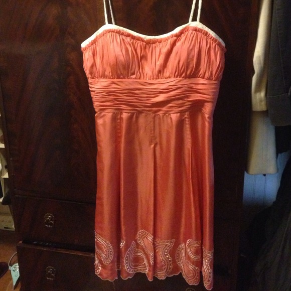 Coral Dress: Lace piping, ruffled in the chest.