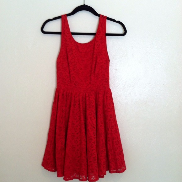 Red lace skater dress , very low back .
