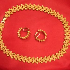Bold gold necklace with clip earrings