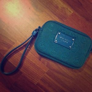 Michael Kors™ wristlet.