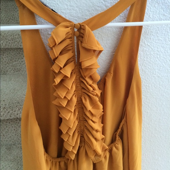 Low back mustard yellow ruffle top