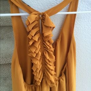 Low back mustard yellow ruffle top