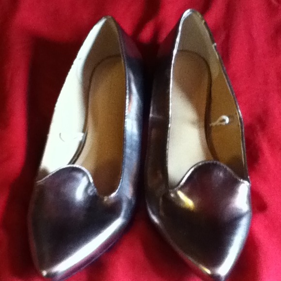 Forever 21 silver flat shoes .