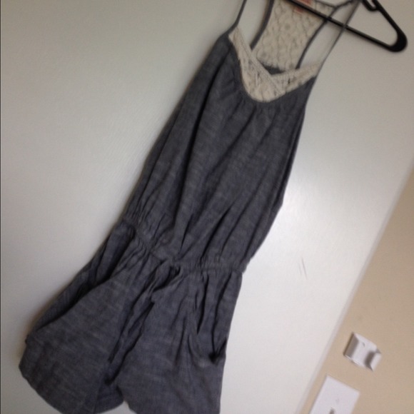 Dark grey, romper with spaghetti straps.