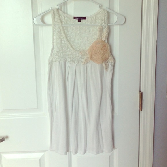 Cream lace top, pink buttonup, and floral bracelet