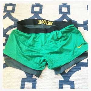 Green nike shorts with attached spandex