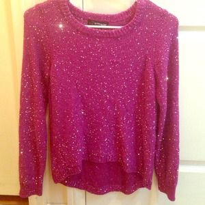 A purple glittery polyester long sleeve shirt