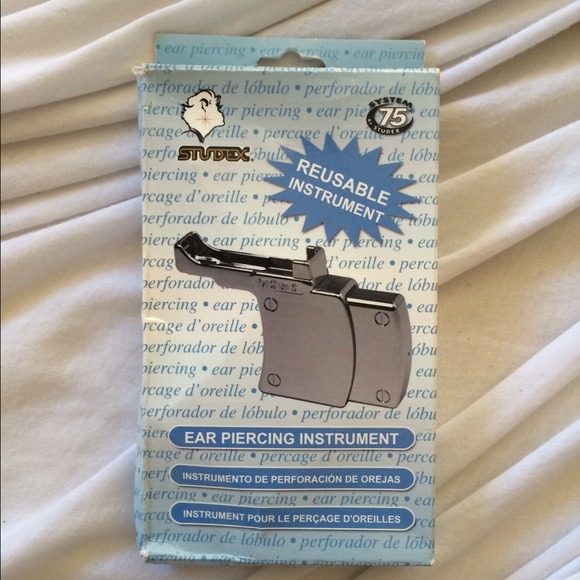 Reusable ear piercing instrument