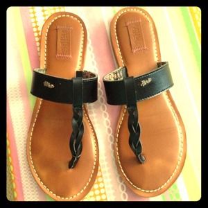 Cute black leather flip flops.