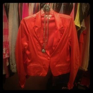Orange cover up jacket from The Buckle