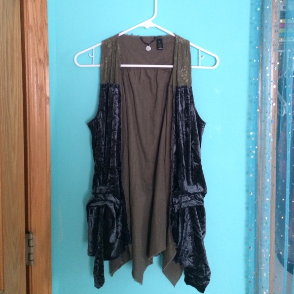 Fabric vest with green lace around neck