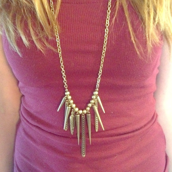 Gold tribal necklace.