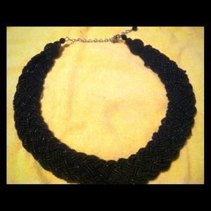 Black bead braided necklace.