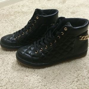 Quilted black and gold sneakers