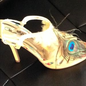 Yellow shoe with peacock feathers