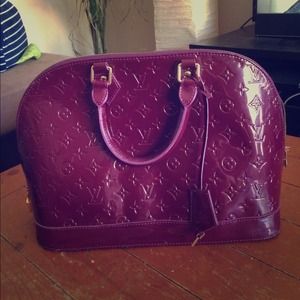 Purple Louis Vuitton bag with matching wallet