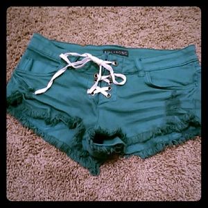 Green Billabong cut off denim shorts
