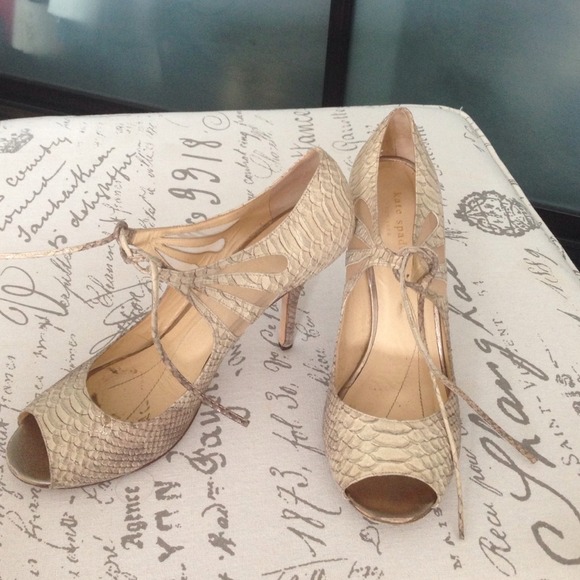 Embossed open toe pumps.