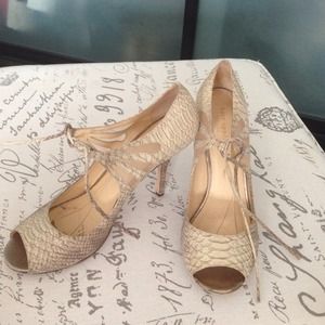 Embossed open toe pumps.