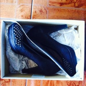 Studded black suede pumps