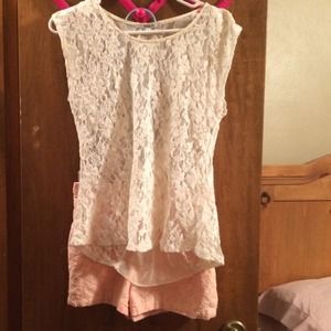 Bundled shorts and lace shirt
