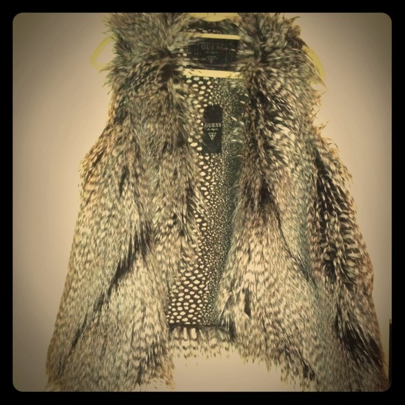 Black, grey, and white Guess faux fur vest.