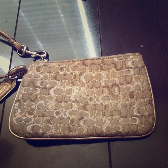 Gold coach wristlet