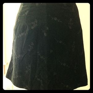 Necessary Objects black on black miniskirt.