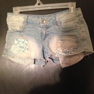 Denim blue patched faded shorts