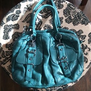 Chic Green leather bag with gunmetal grey details!