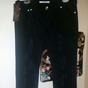 Distressed black straight leg jeans.