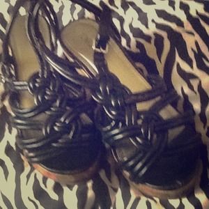 Black and cork knot tied shoes