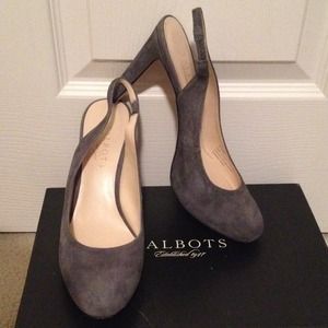 Grey suede sling back platform heels.